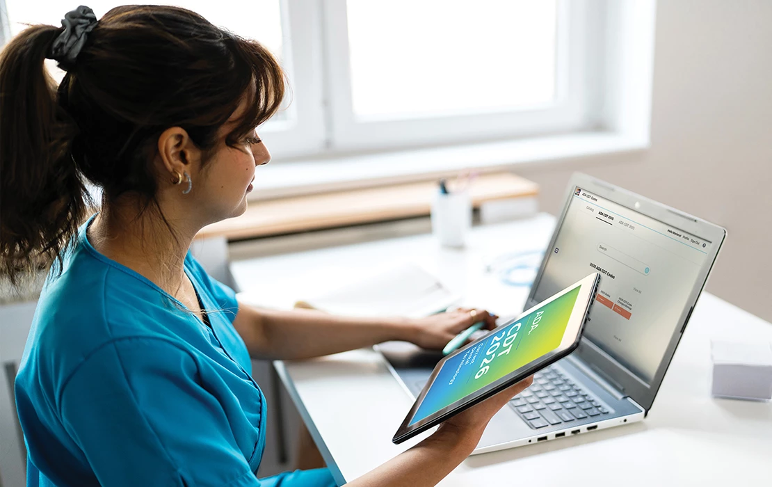 Dental practioner reviewing CDT 2026 resources
