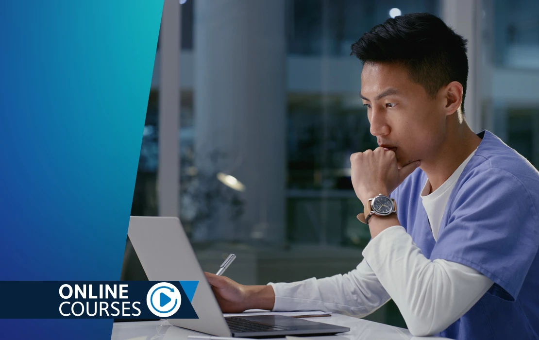 Man sitting at computer looking intensely at the screen
