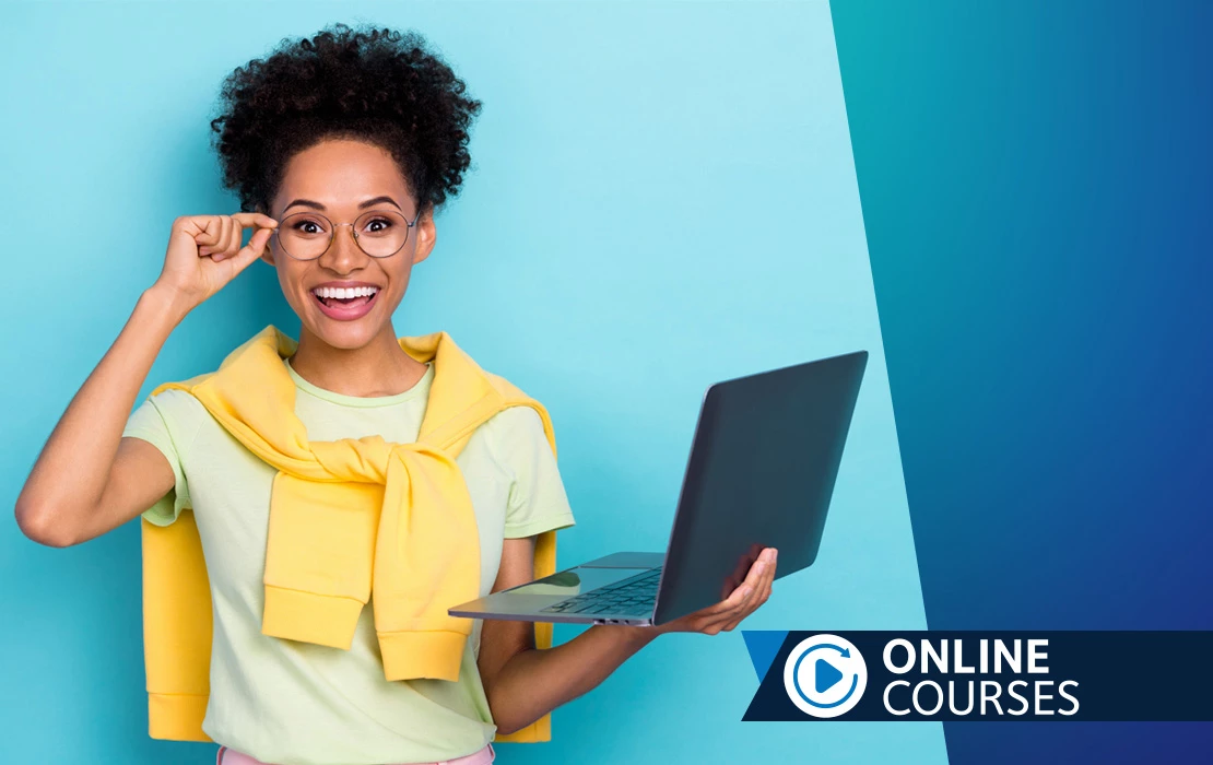 Smiling woman holding laptop computer