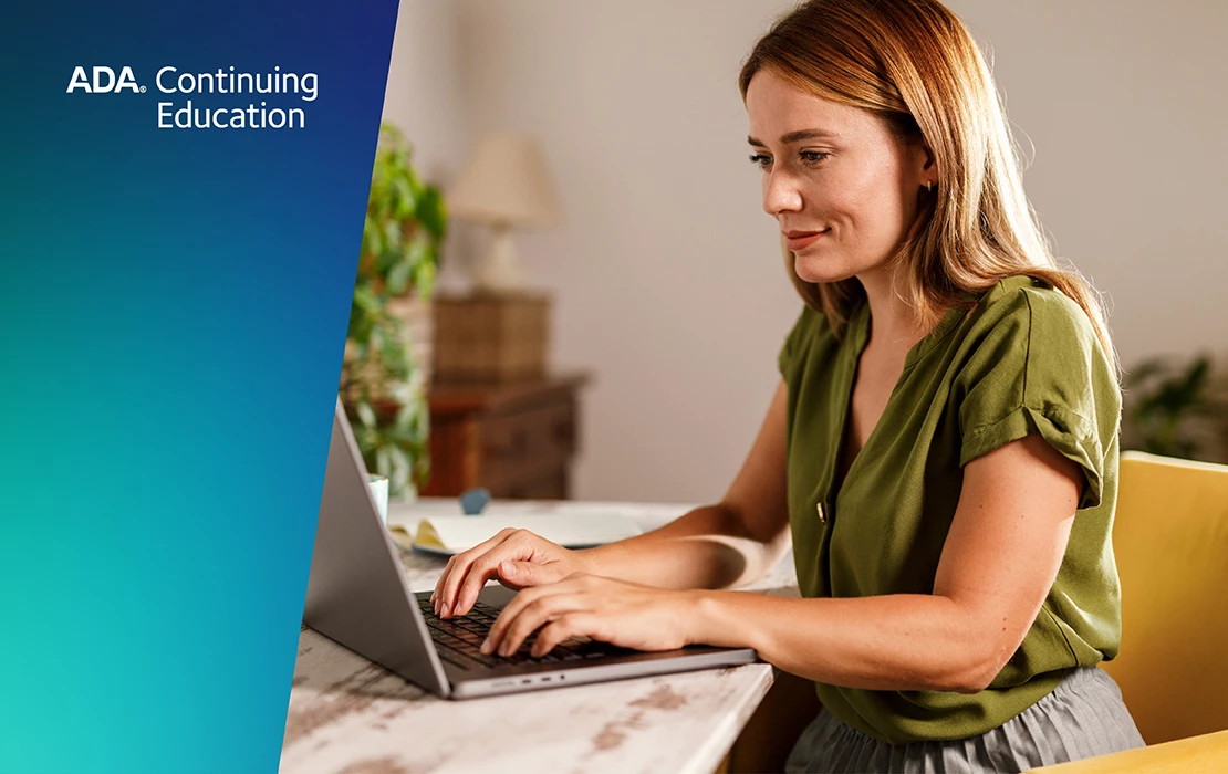 Image of a woman working on a laptop