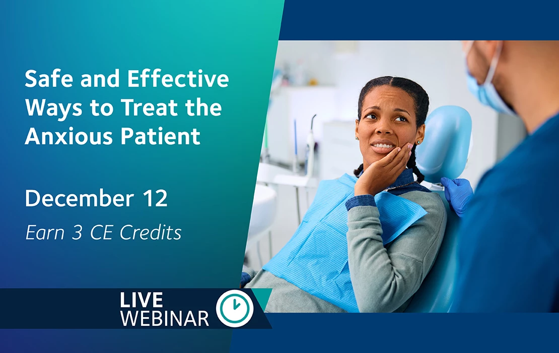 female dental professional standing over pediatric patient in dental treatment chair